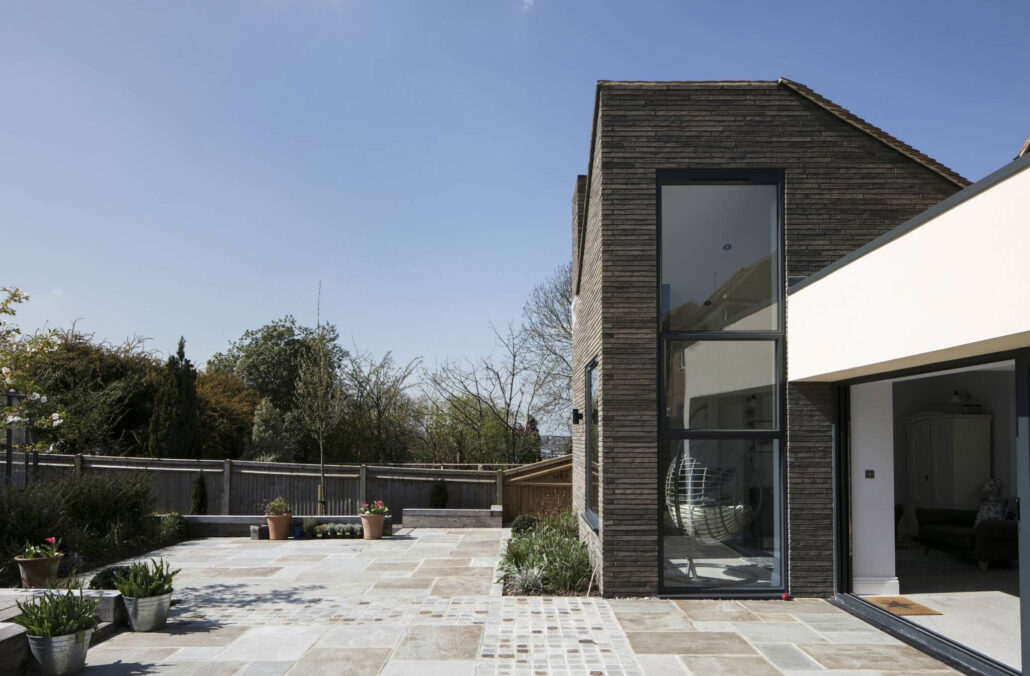 Modern home extension and landscaped terrace